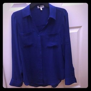 Blue button down shirt.